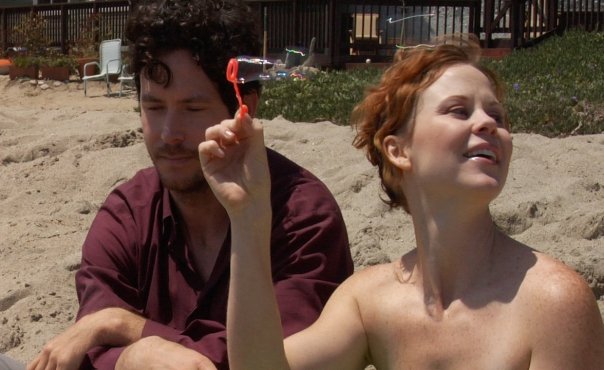 Achilles (Will Beinbrink) and Persephone (Kiersten Morgan) on the beach in 