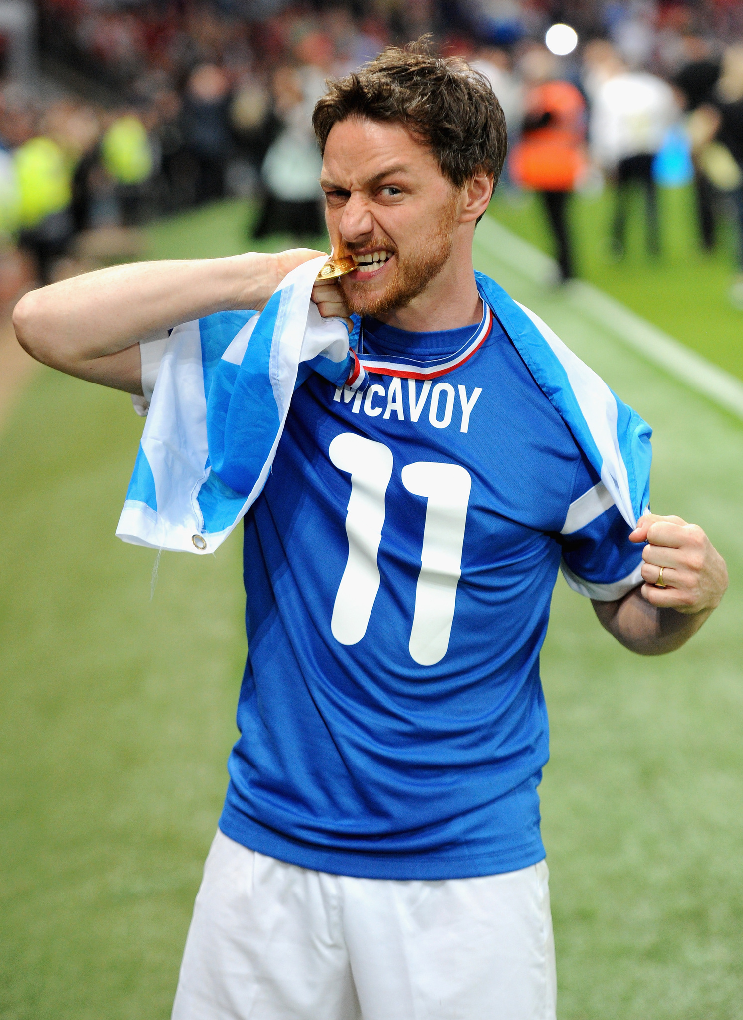 James McAvoy of the Rest of the World team celebrates victory in the Soccer Aid 2014 match at Old Trafford on June 8, 2014 in Manchester, England.
