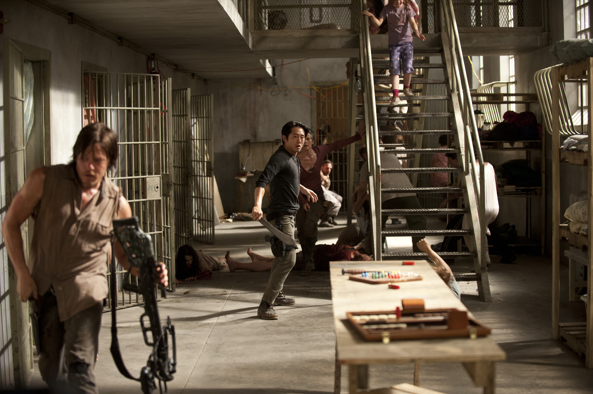 Still of Norman Reedus, Melissa McBride and Steven Yeun in Vaiksciojantys negyveliai (2010)