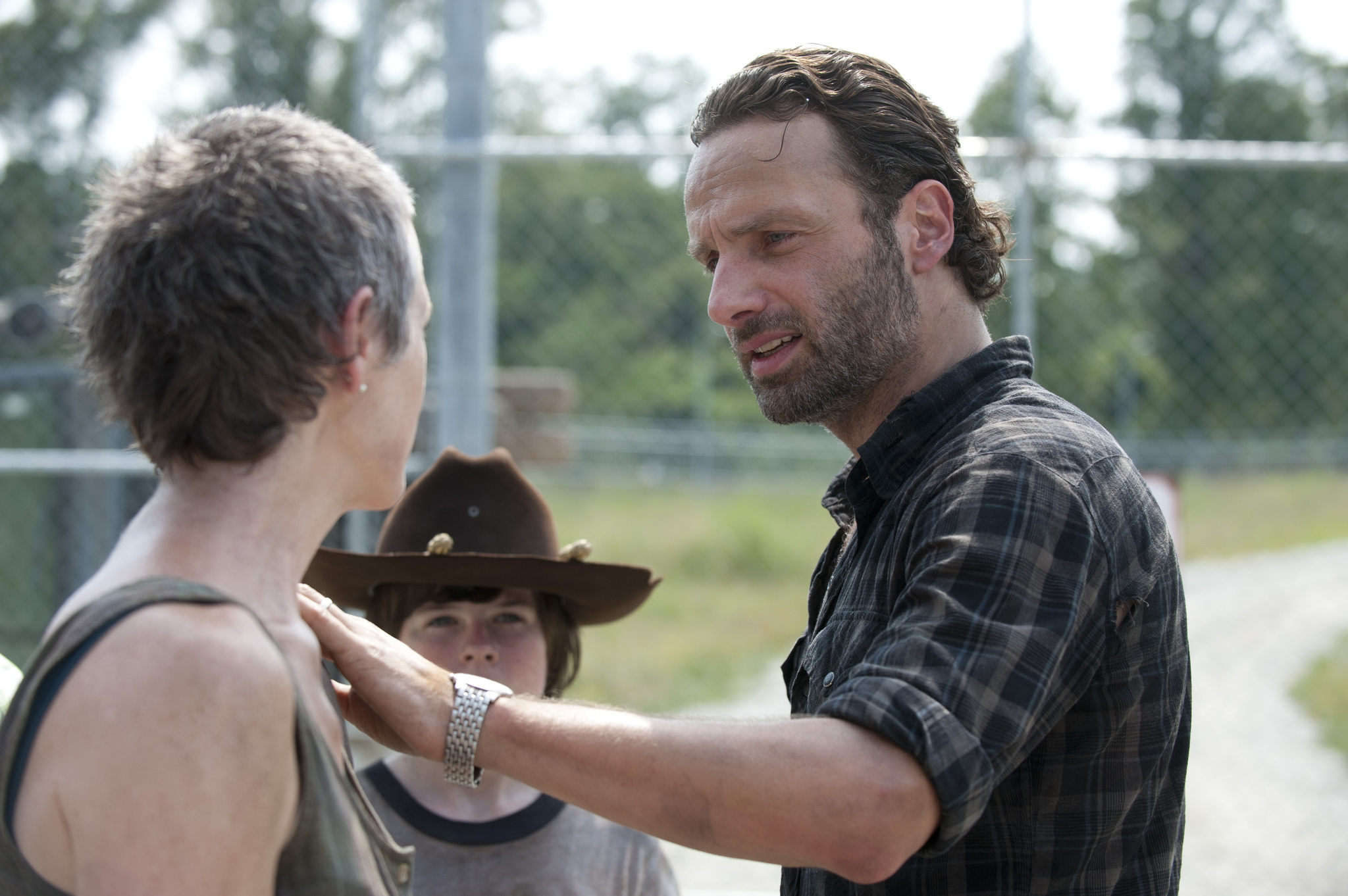 Still of Andrew Lincoln, Melissa McBride and Chandler Riggs in Vaiksciojantys negyveliai (2010)