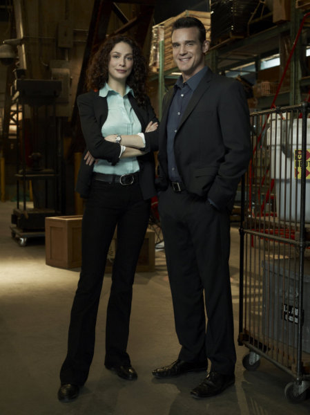 Still of Eddie McClintock and Joanne Kelly in Warehouse 13 (2009)