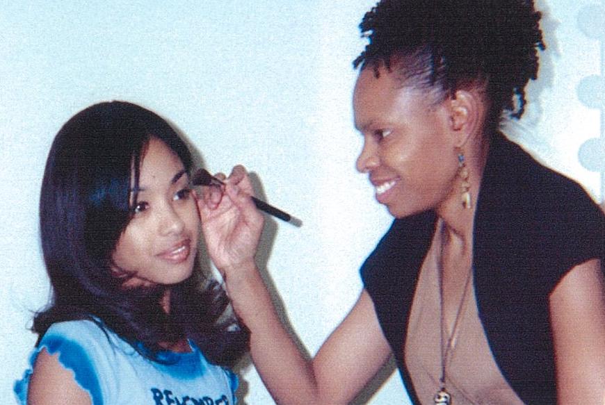 Cat'Ania McCoy-Howze applies makeup on Davetta Sherwood for a promotional photo-shoot for the TV show Platinum