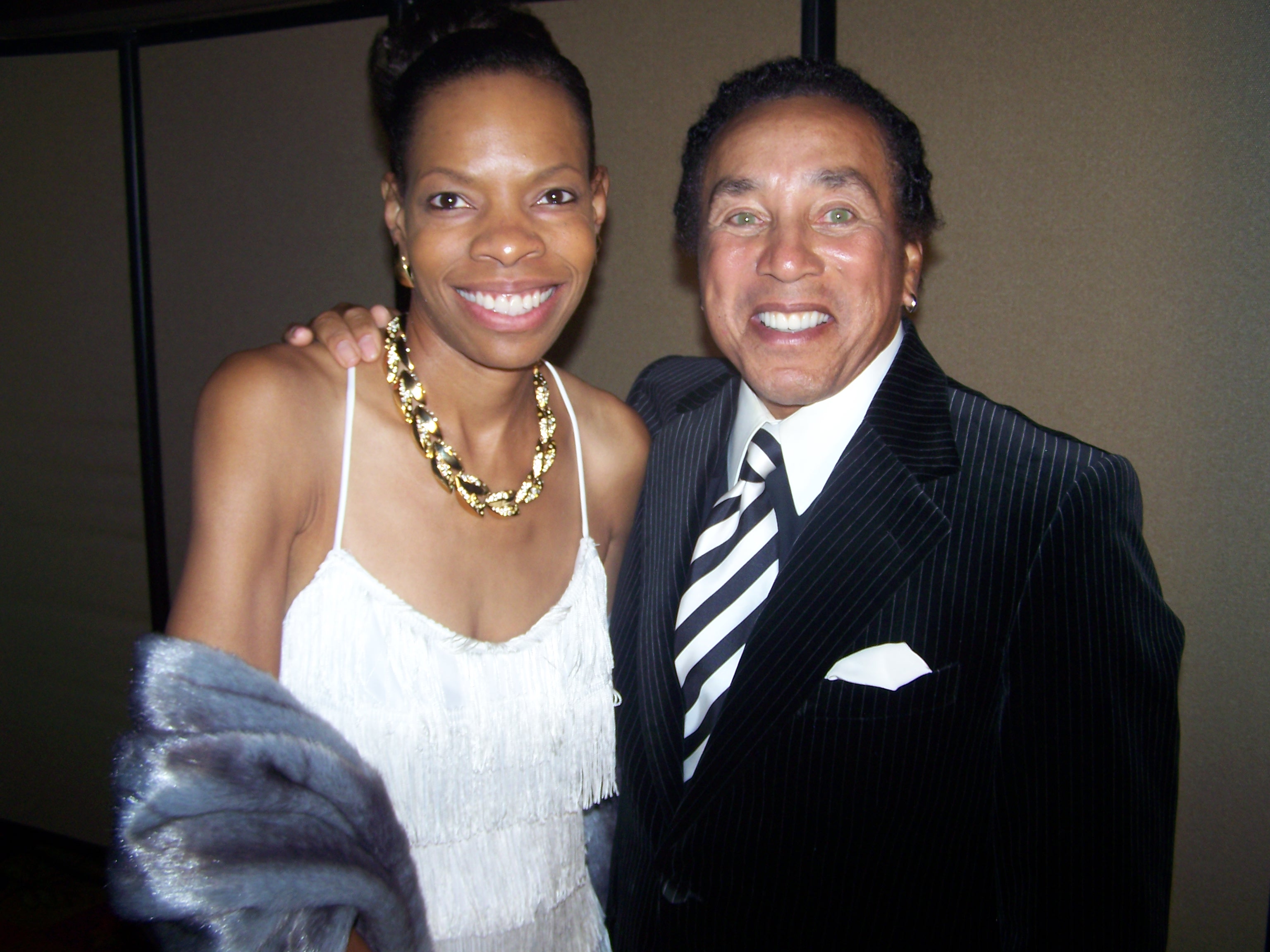 Cat'Ania McCoy-Howze photographs with Smokey Robinson after she interviews him at the Temecula Film Festival