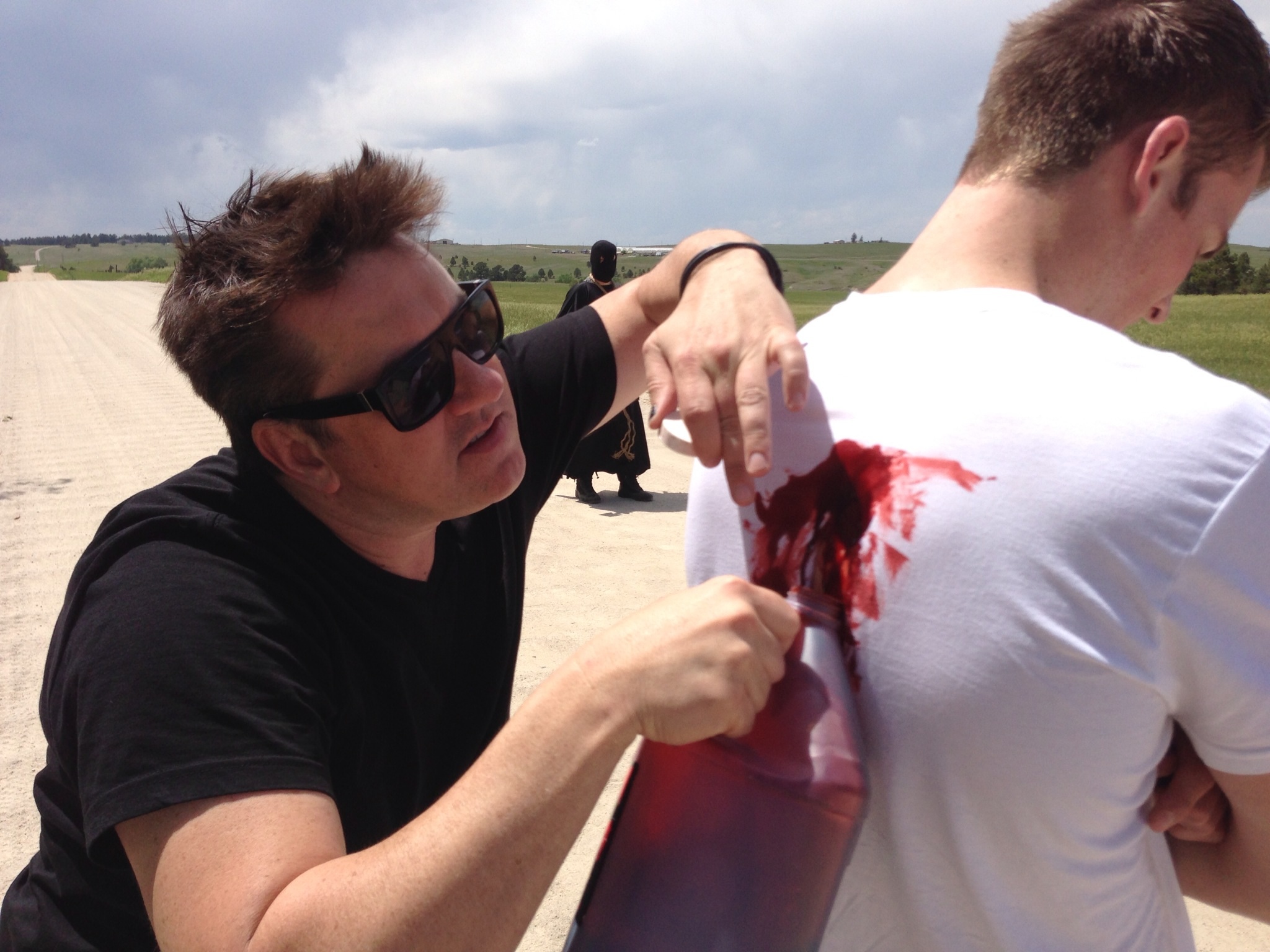 Director Brian McCulley inspects make up on the set of 