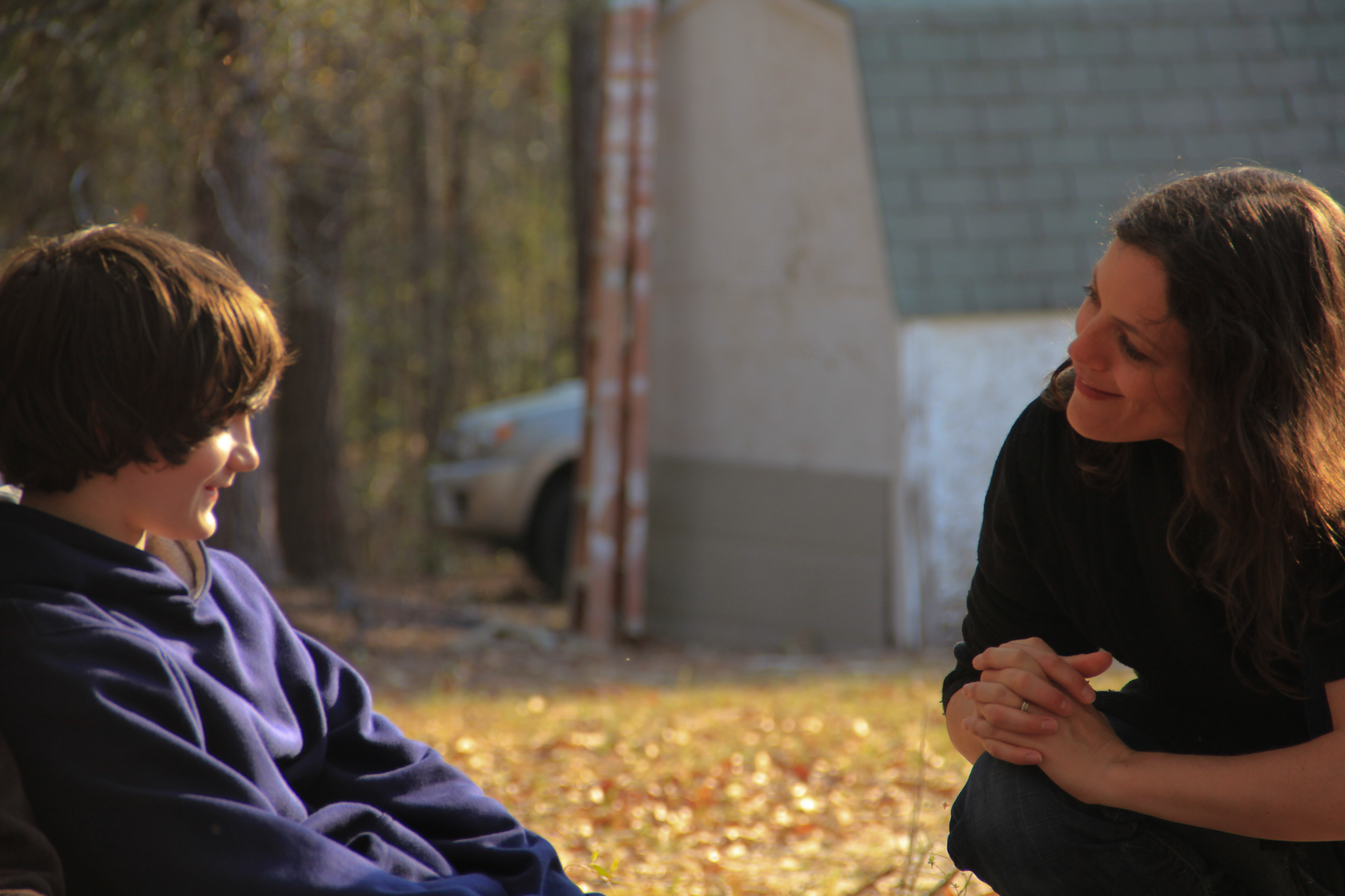 Director Emilie McDonald speaking to actor Tyler Williams during CROSSING THE RIVER shoot