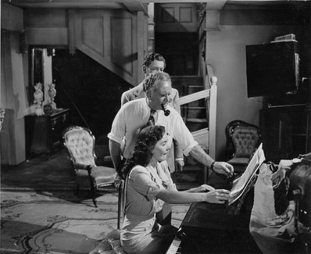 CATHERINE McLEOD rehearsing with director Frank Borzage on the set of I've Always Loved You as leading man Philip Dorn looks on