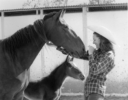 Lee Meriwether with a horse and pony c. 1975
