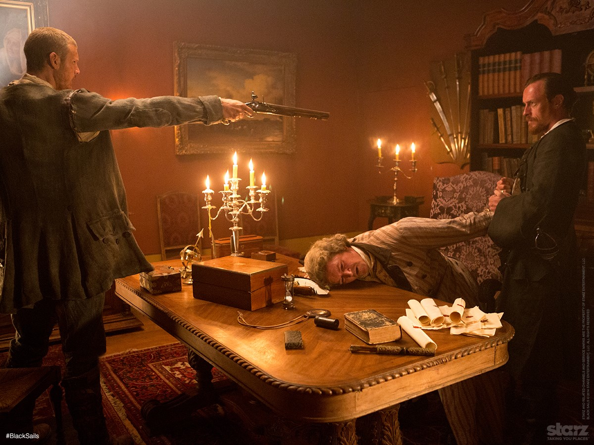 A scene from Black Sails season 1 episode 1 with Tom Hopper, Sean Cameron Michael and Toby Stephens.