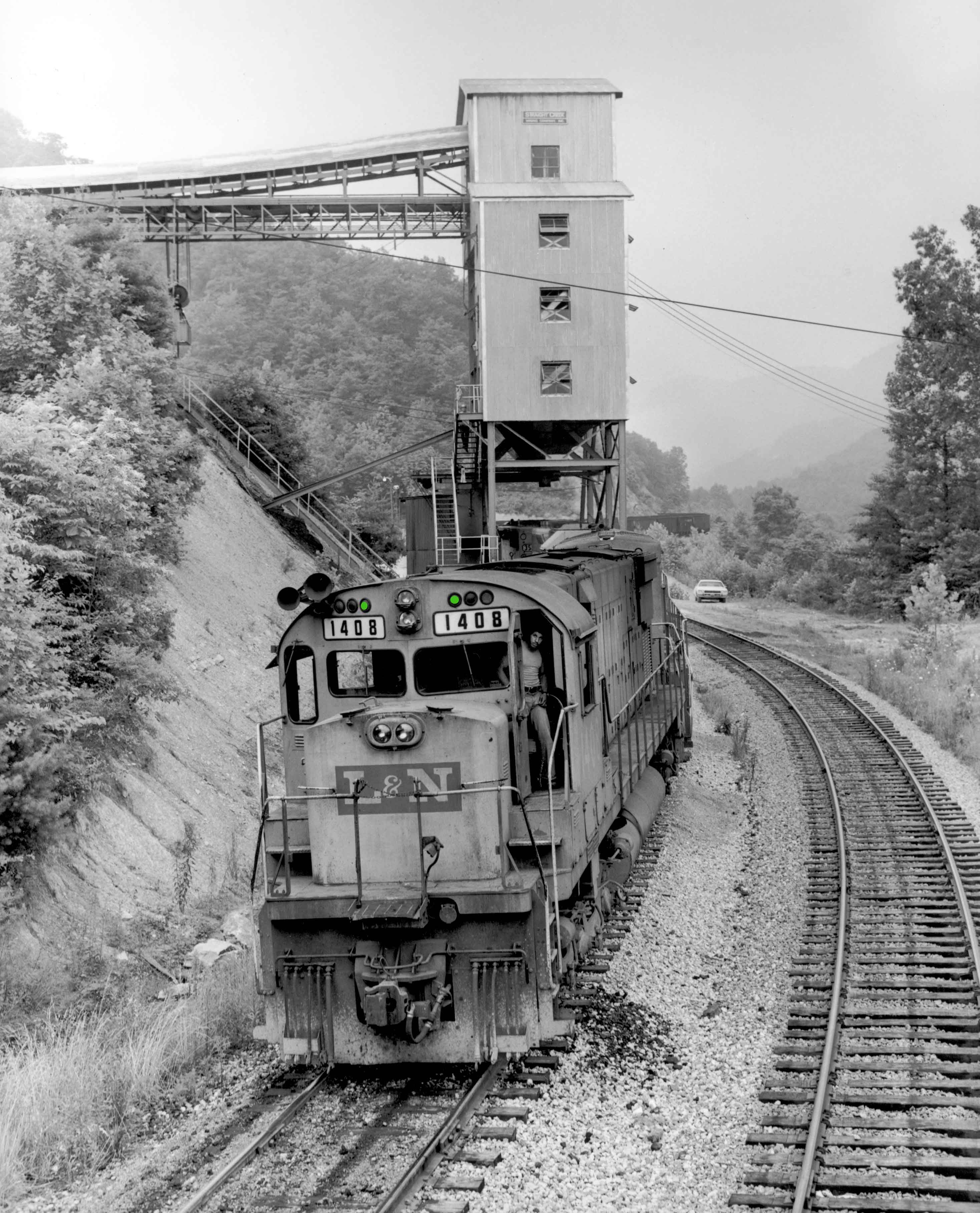 1977. Six-axle ALCO's reign supreme on the L&N's Corbin Division. However, there was always time for the Engineer to grab a classic photo. At KANEB Energy tipple on Straight Creek Extension, deep in the coalfields east of Pineville.
