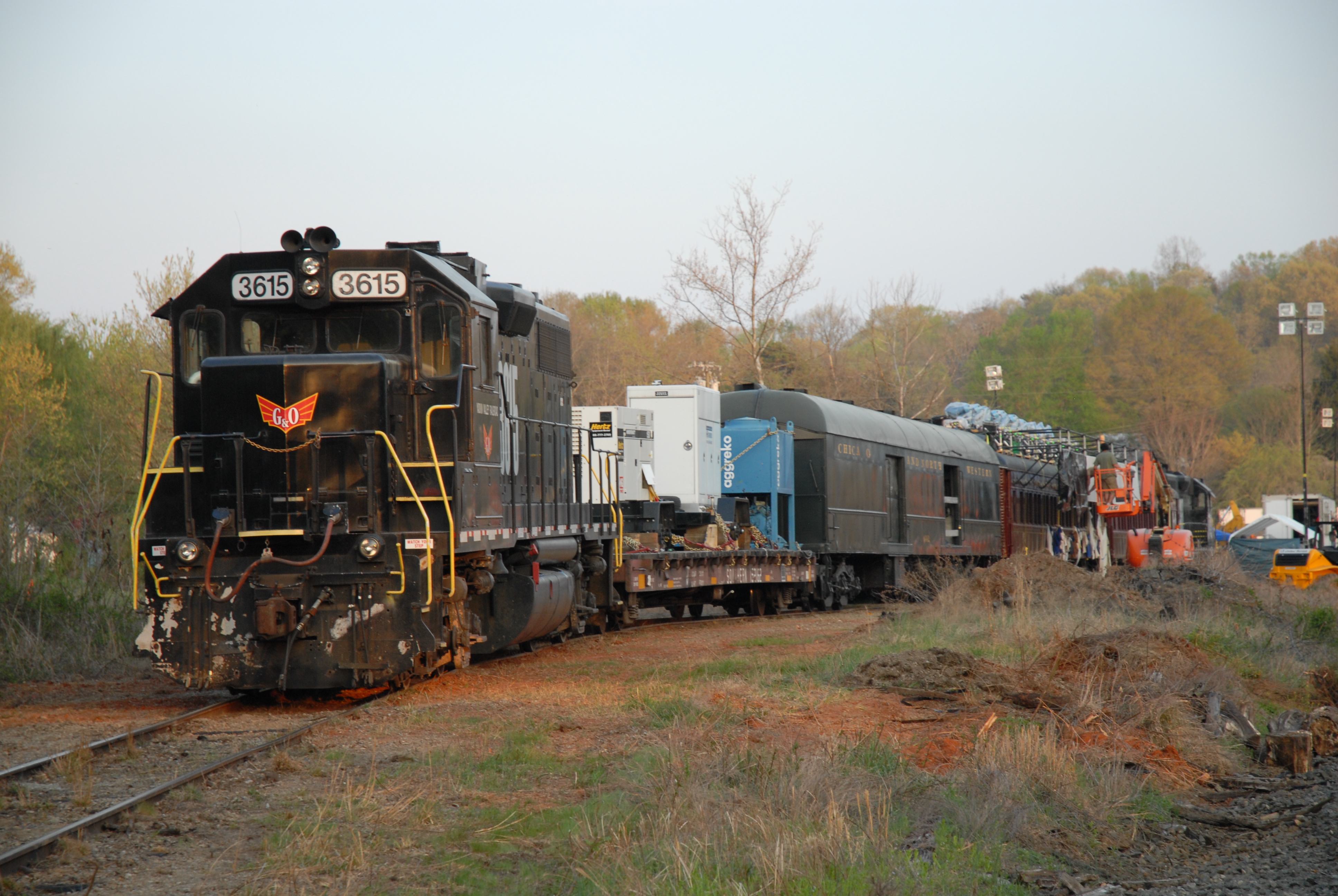 On location. Leatherheads. Yadkin Valley Railroad (YVRR). 2006. The LH movietrains prepares to depart Donnaha Siding for another long and flawless shoot day. YVRR operated LH's movietrain for 4 days of on-time and safe production work.