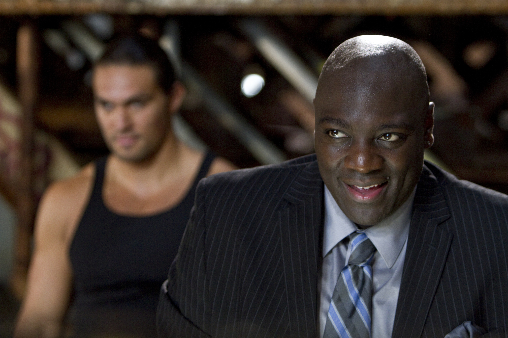 Still of Adewale Akinnuoye-Agbaje and Jason Momoa in Bullet to the Head (2012)