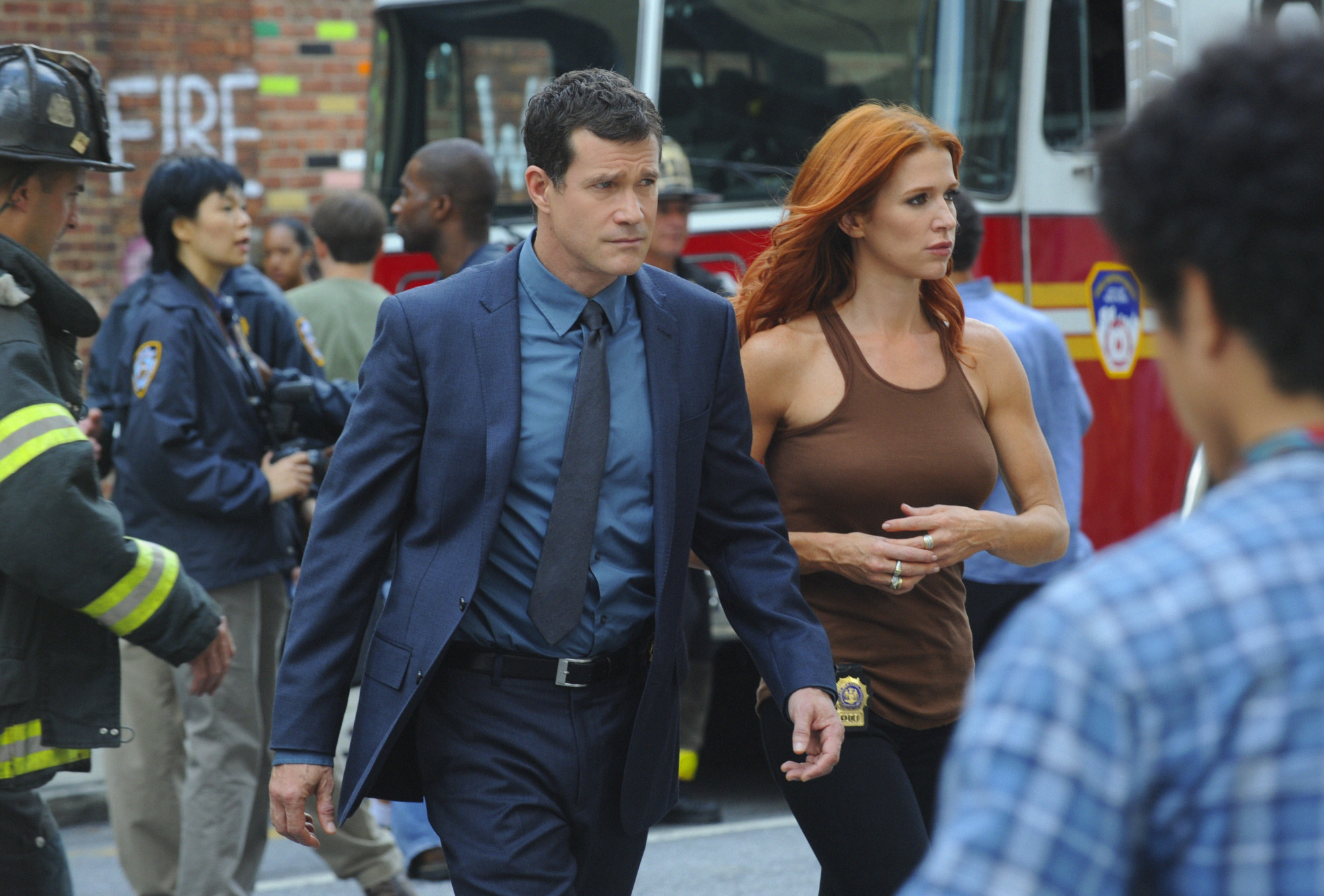 Still of Poppy Montgomery and Dylan Walsh in Unforgettable (2011)