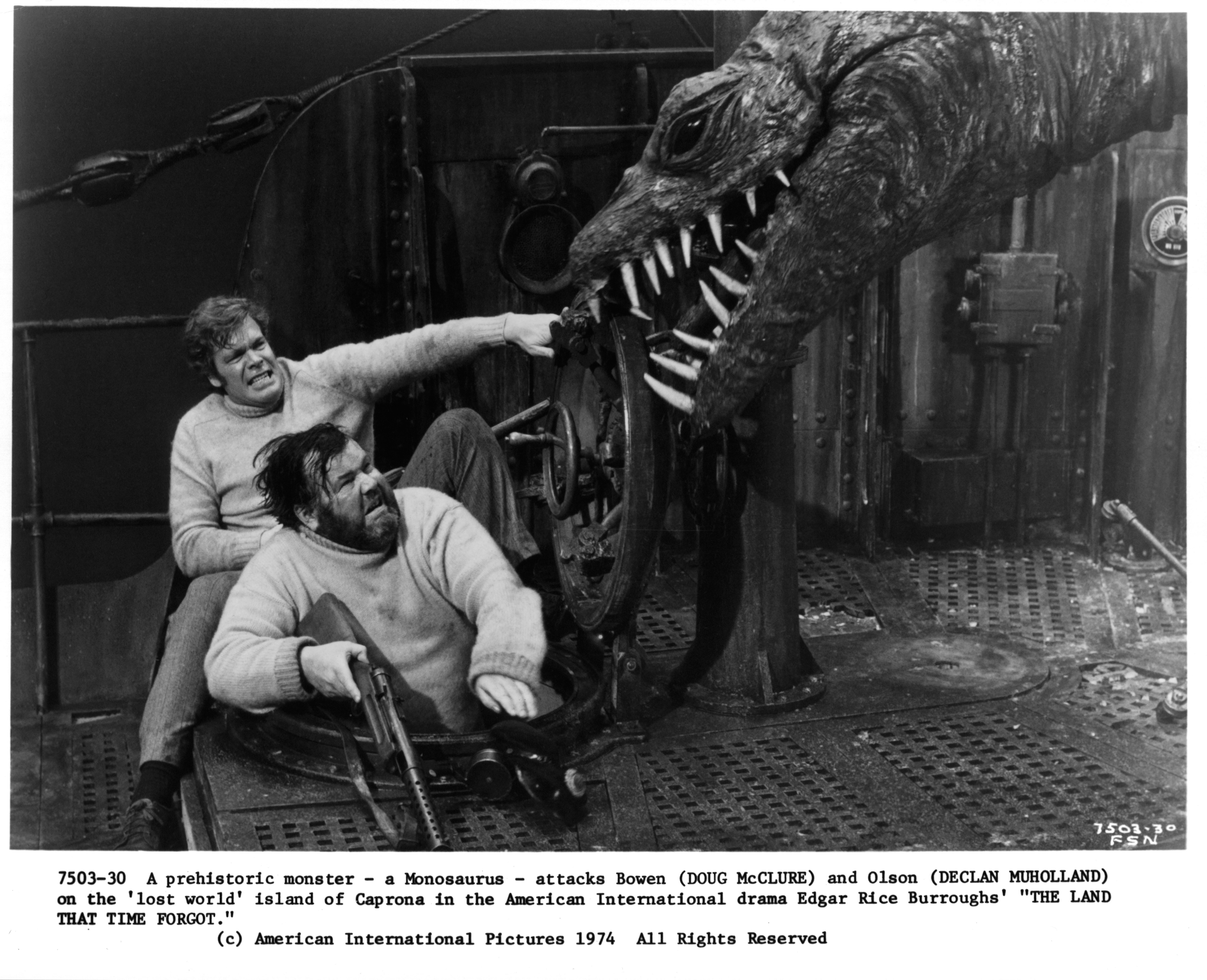 Still of Doug McClure and Declan Mulholland in The Land That Time Forgot (1975)