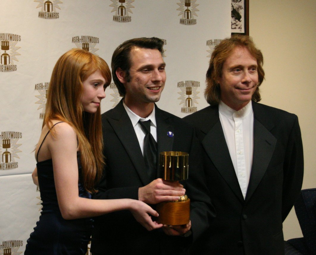 Presenters Liliana Mumy (l) and Bill Mumy (r) with Michal Makarewicz, winner for feature character animation