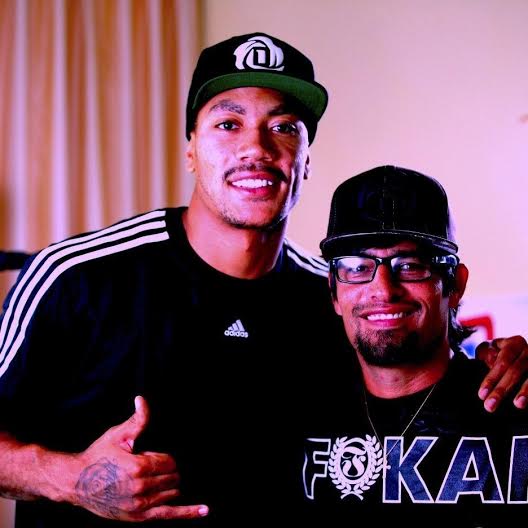 Alex with basketball player Derrick Rose