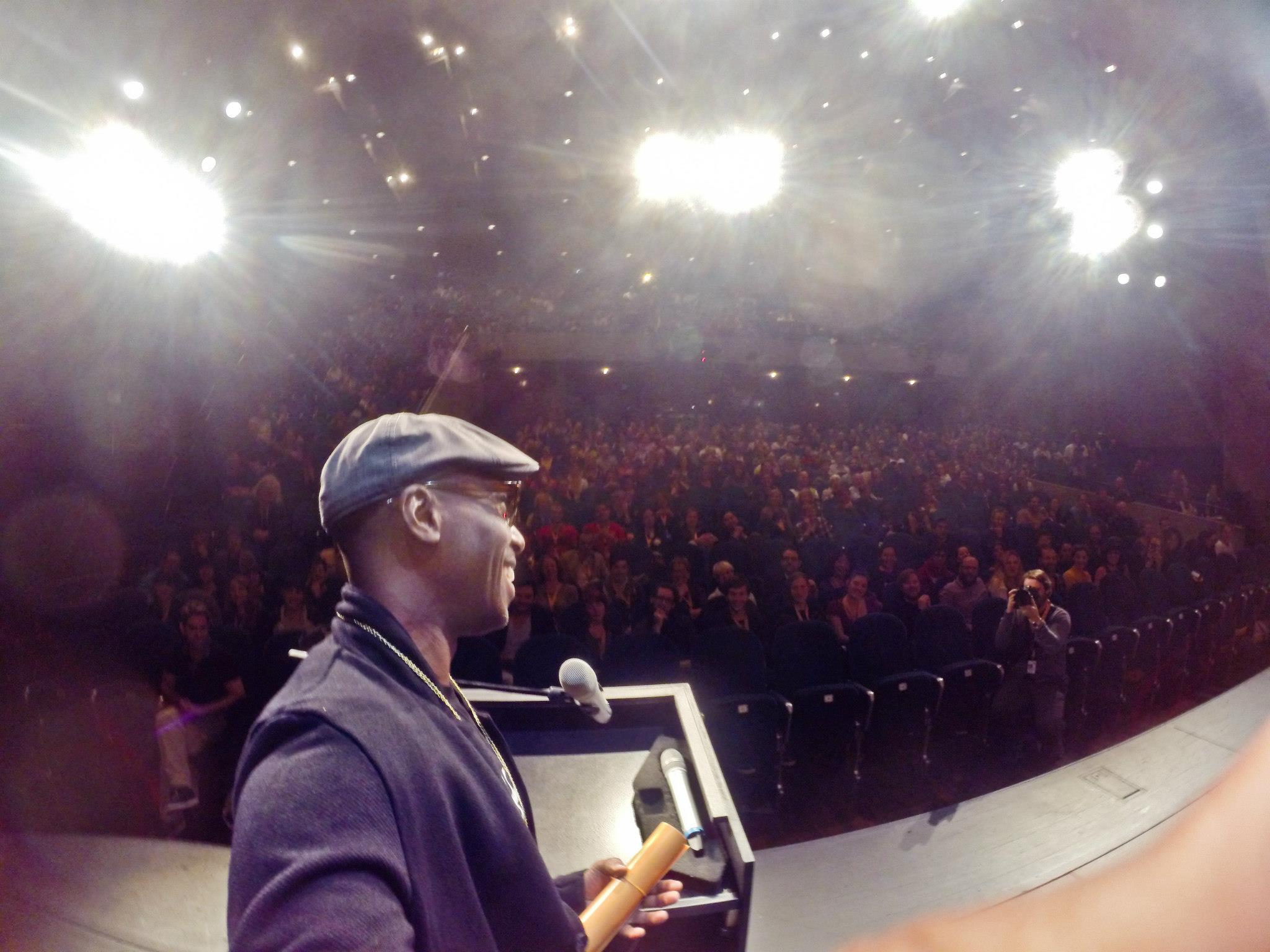 Ntare Guma Mbaho Mwine takes selfie while accepting award for his short film KUHANI at the Internationale Kurzfilmtage Winterthur in Switzerland 2014
