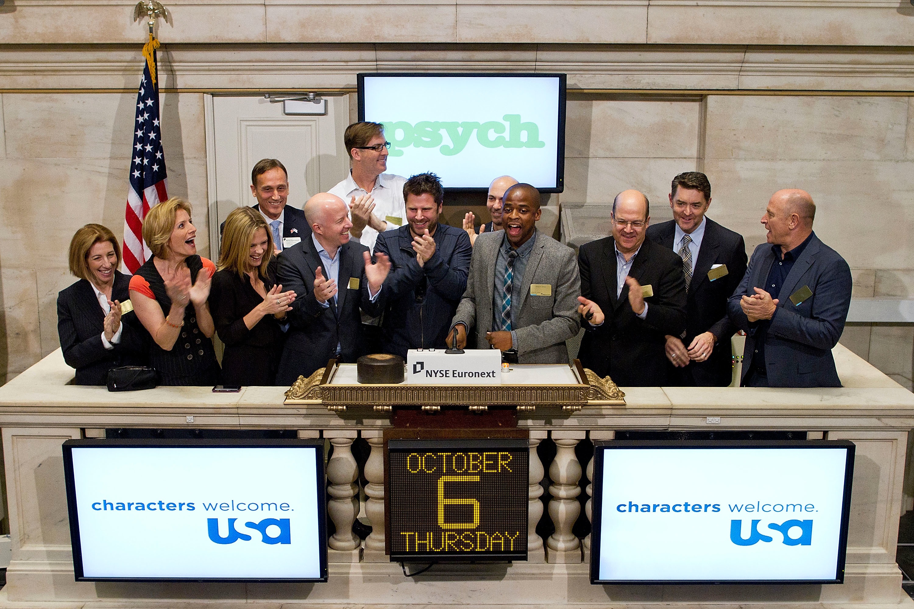 NYC, NY - USA Network's PSYCH rings in the NYSE bell (L-R) EP Kelly Kulchak, Kirsten Nelson, Maggie Lawson, NYSE VP, USA Co-Pres Chris McCumber, EP Steve Franks, James Roday, EP Chris Henze, Dule Hill, USA CoPres Jeff Wachtel, Timothy Omundson, C. Bernsen