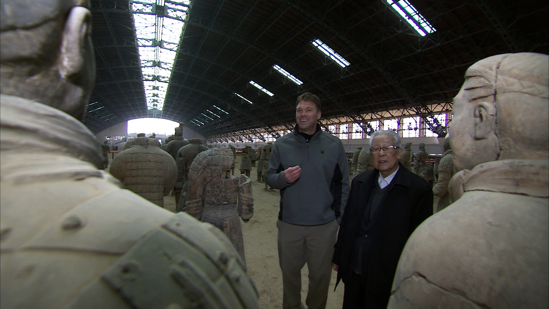 Keith and director Zhongyi with the Terracotta Soldiers. Archaeological pit, Xi'an China.