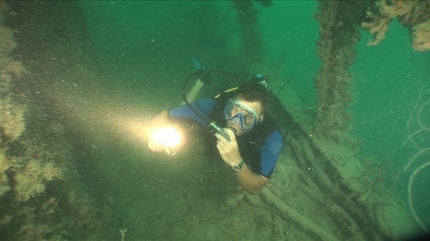 TV Series - American Xplorer: Expedition Central America. Keith Neubert diving a virgin shipwreck off the coast of Belize Central America.