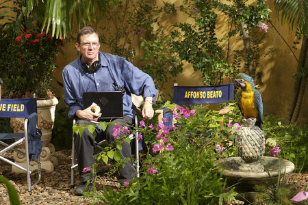 Director Mike Newell and Pacho, the parrot