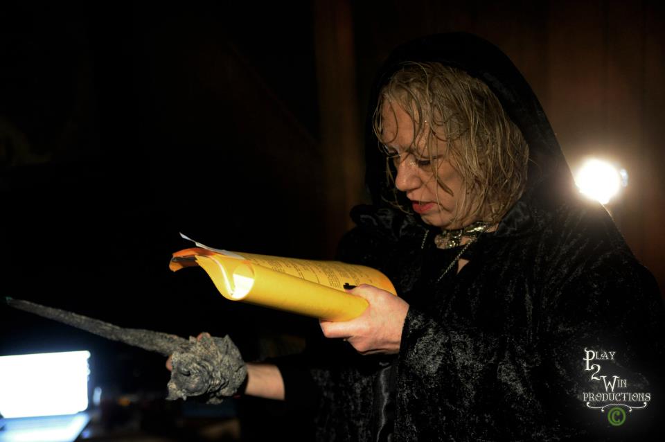 Jamie Newell checks her lines (incantation) as the evil Devilla in Teller Of Tales-A Fib Fit For A King