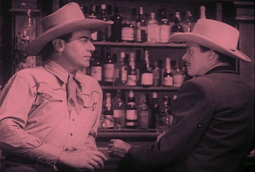 I. Stanford Jolley and James Newill in Guns of the Law (1944)