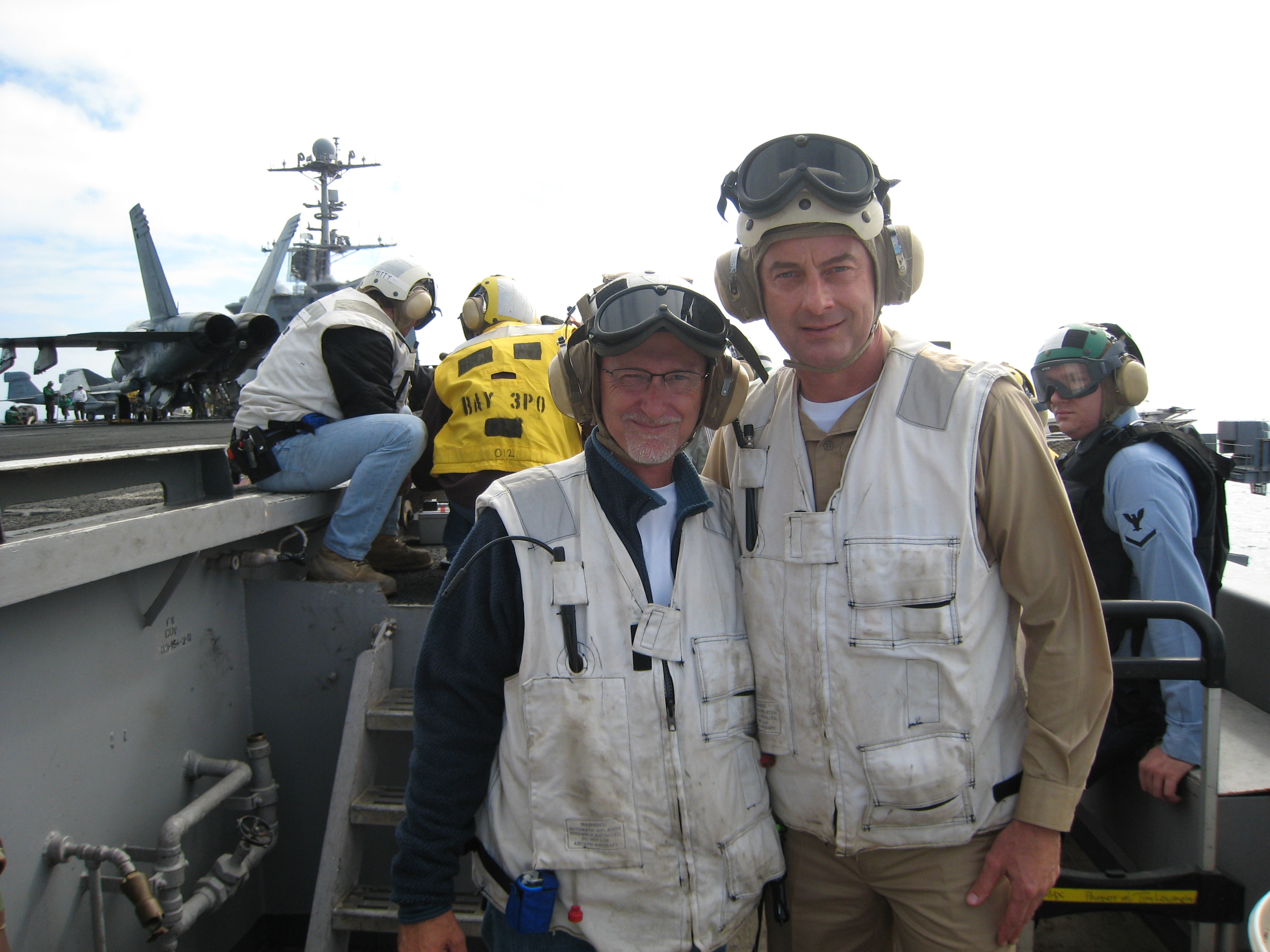 Ian Bryce & John Nielsen on the deck of the USS John C Stennis for 