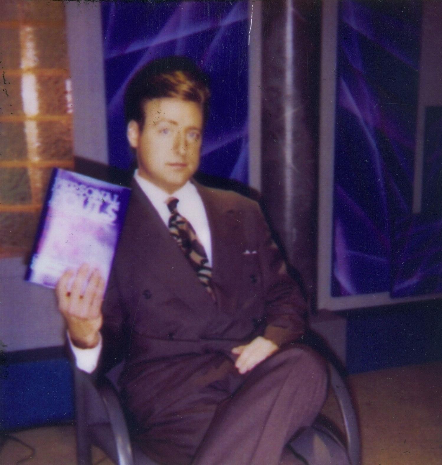 NEVER GIVE UP; THE JIM VALVANNO STORY: Patt Noday: poses between takes while filming on-location in downtown Wilmington, NC at the WWAY Television Studio Complex.