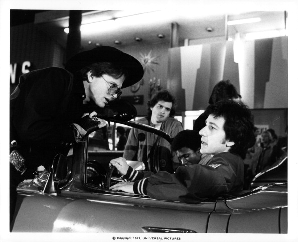 L-R: David Wilson, Thomas Carter, Allen G. Norman and Bruno Kirby, sitting in a car, in a scene from the film 'Almost Summer', 1978. (Photo by Universal Pictures/Getty Images)