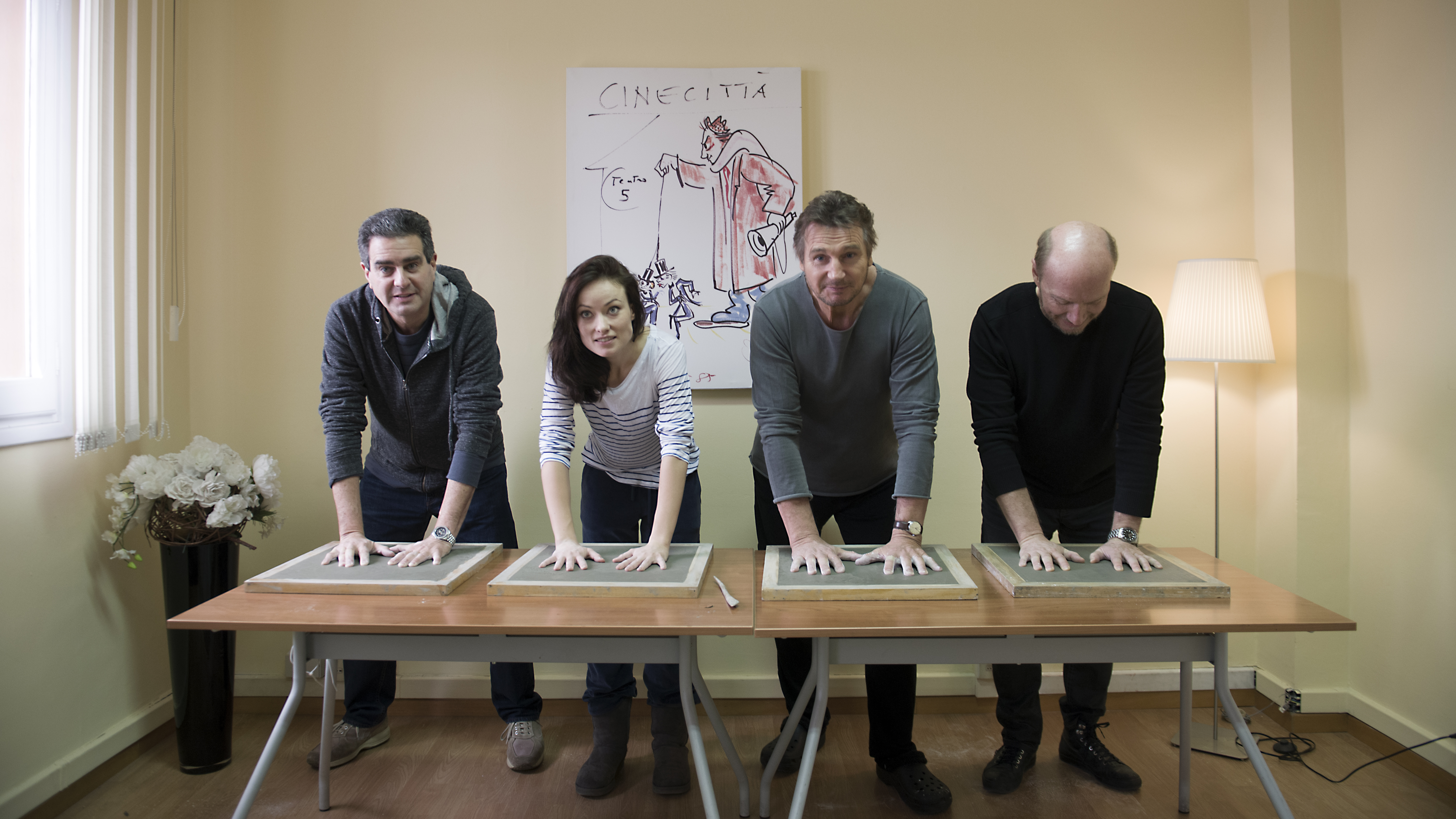 Nozik, Wilde, Neeson and Haggis making hand prints at Cinecitta Studios in Rome following production of Third Person.