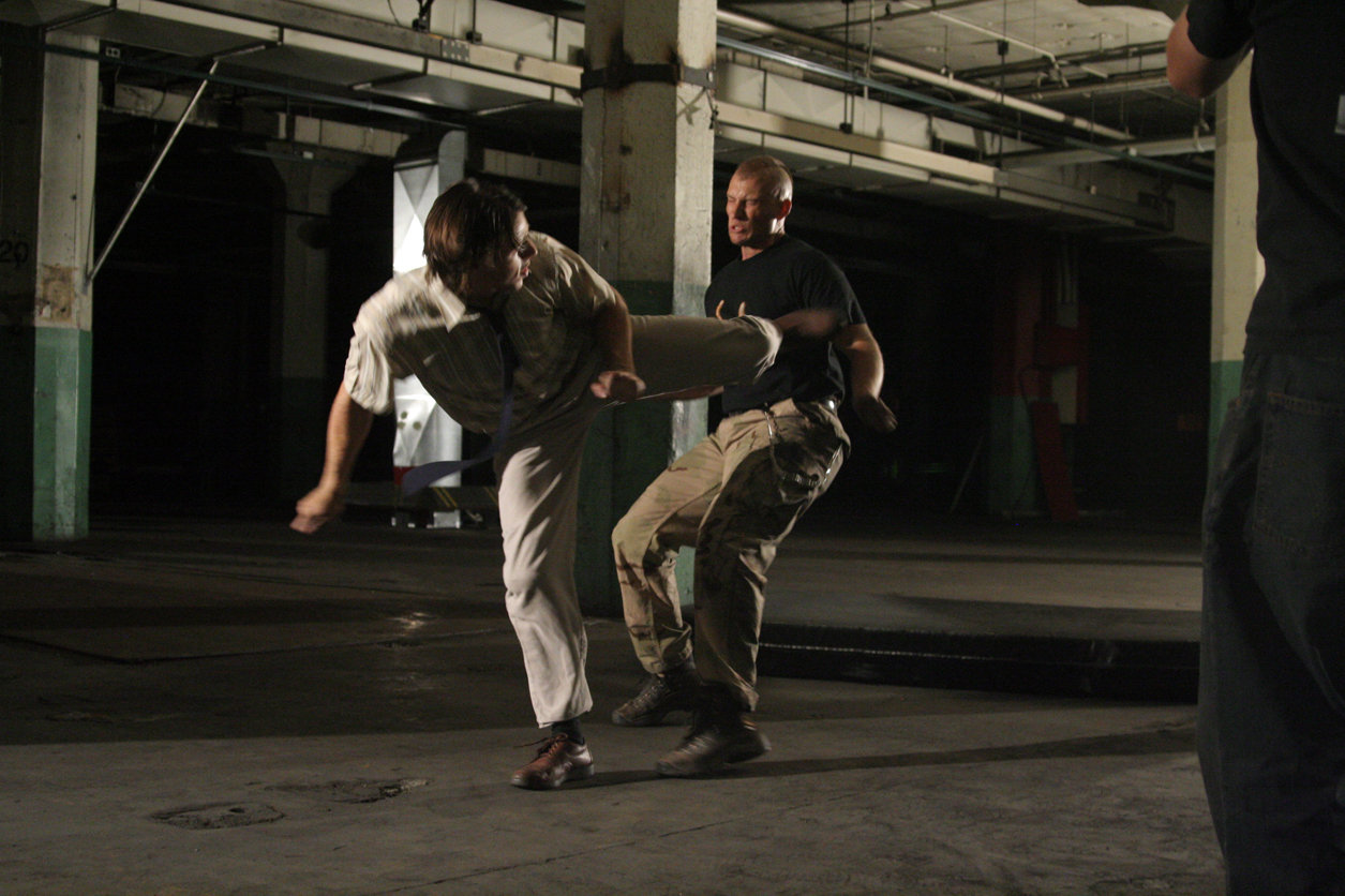 Michael Olaskey as Adult McClain fighting off an attacker.