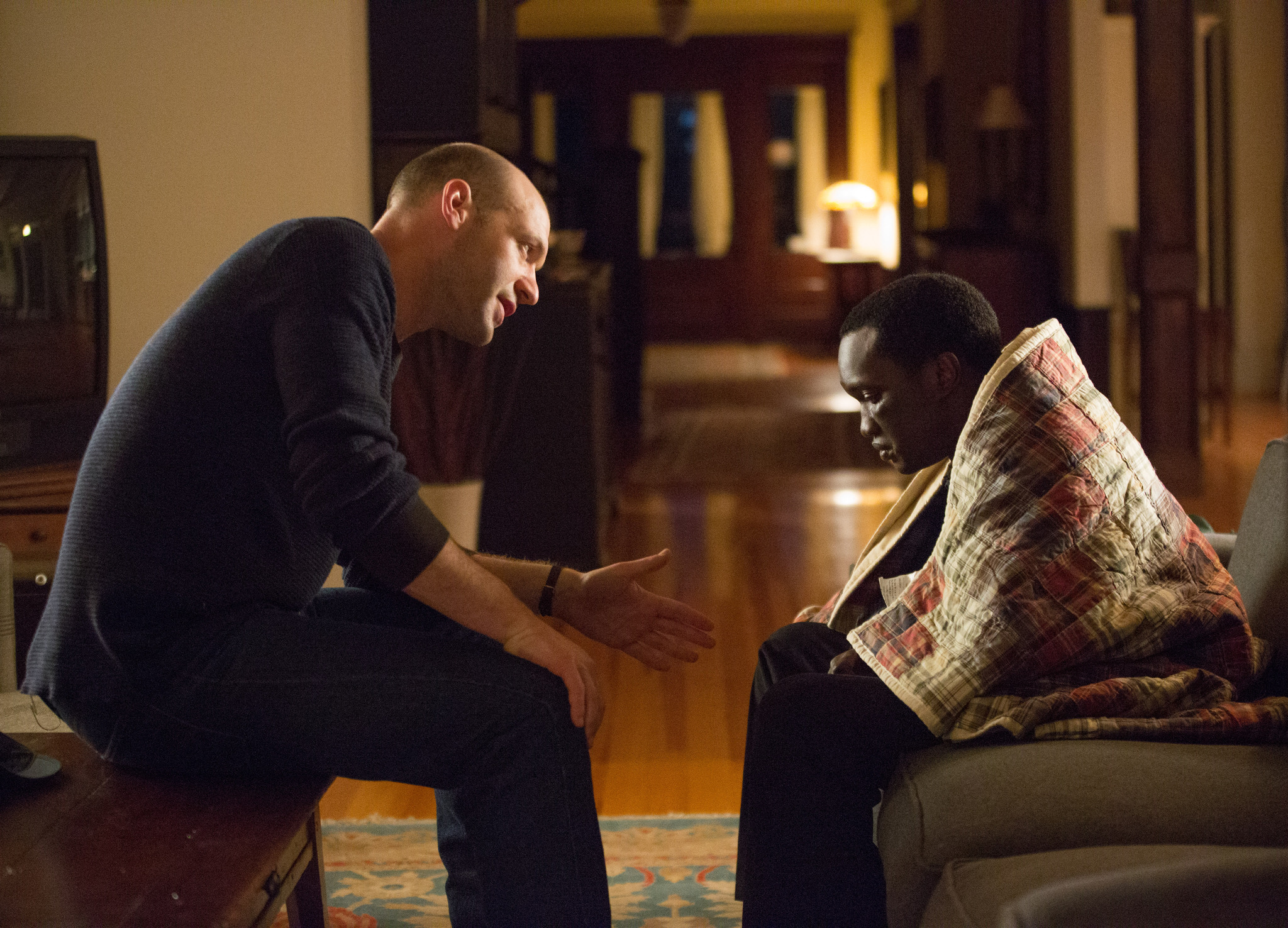 Still of Arnold Oceng and Corey Stoll in The Good Lie (2014)