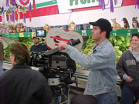 Rick Ojeda on the set of a Starbucks commercial with crew.