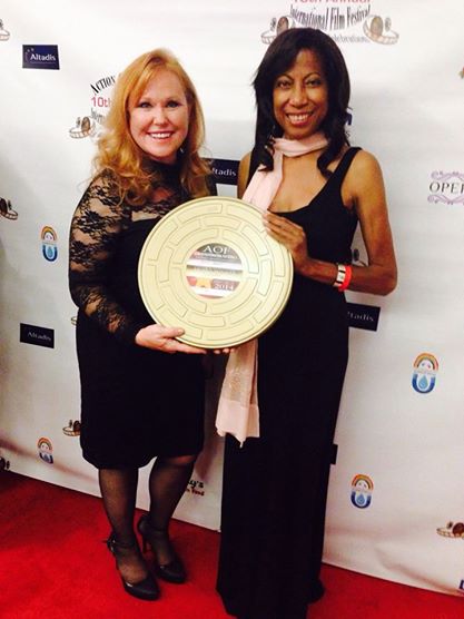 Gwendolyn Oliver and Mary Margaret Martinez with the Best Short Film Award for their film, Surrender, at the AOF Film Festival