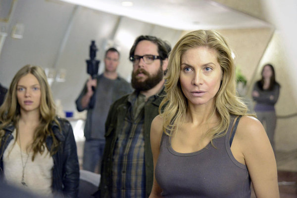 Still of Elizabeth Mitchell, Zak Orth and Tracy Spiridakos in Revolution (2012)