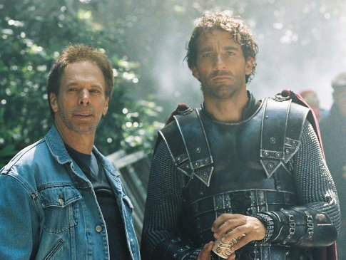 Producer Jerry Bruckheimer (left) speaks with Clive Owen (right) on location.