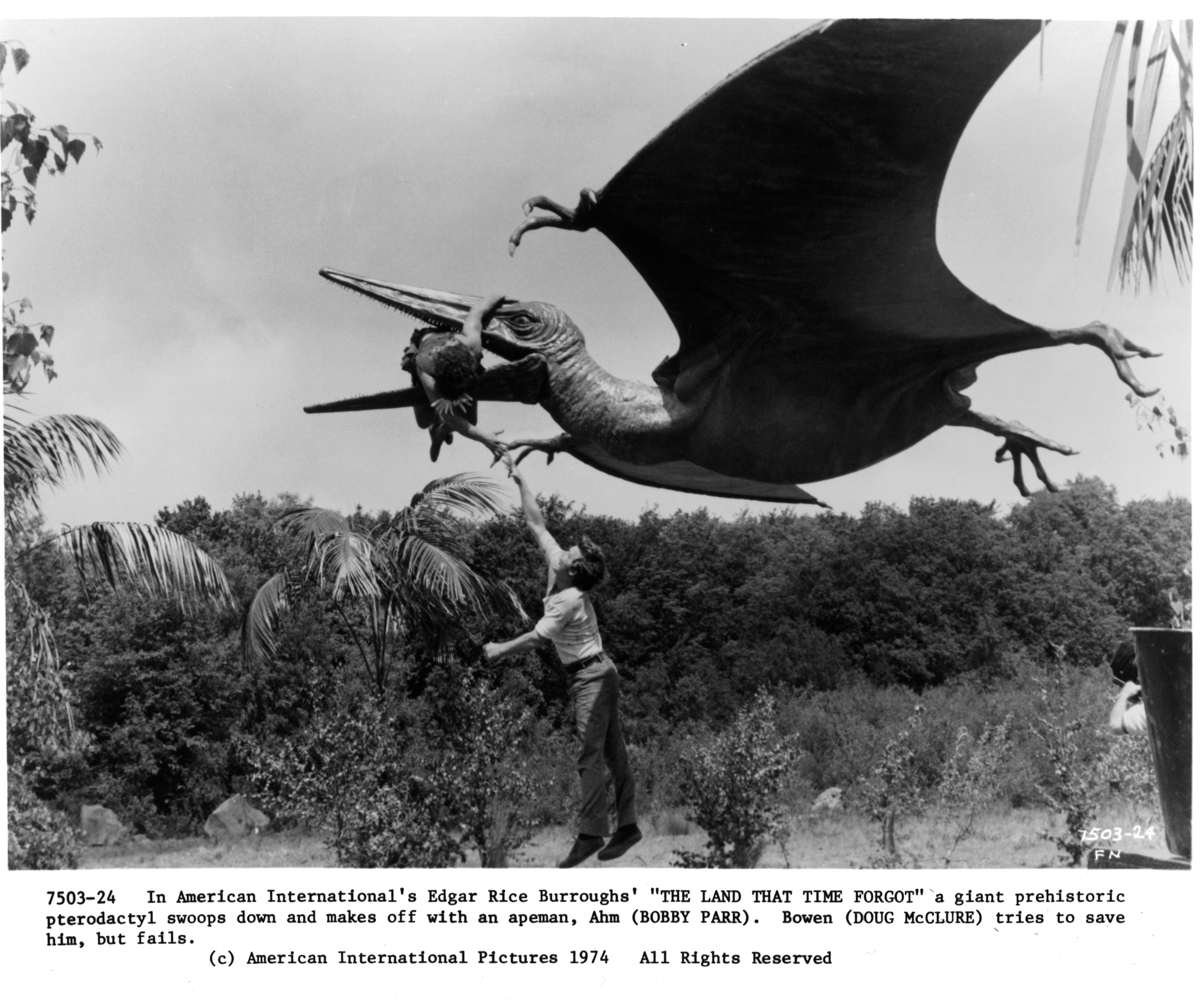 Still of Doug McClure and Bobby Parr in The Land That Time Forgot (1975)