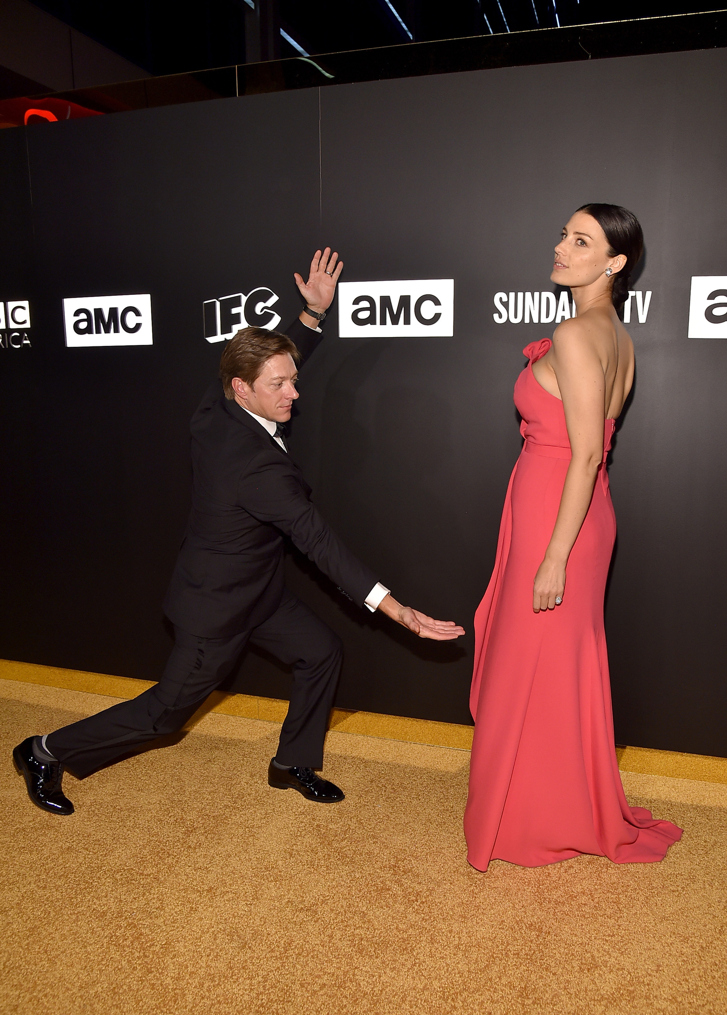 Jessica Paré and Kevin Rahm at event of The 67th Primetime Emmy Awards (2015)