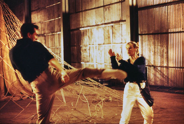 Vincent throwing a roundhouse kick at the ever talented Cynthia Rothrock in the film 