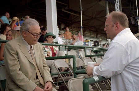 Actor Stacy Keach and writer/director Stu Pollard discuss a scene shooting at Louisville's legendary Churchill Downs racetrack.