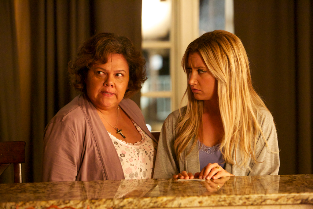 Maria (Lidia Porto) warns Miss Jody (Ashley Tisdale) of bad things in the house. Scary Movie 5.
