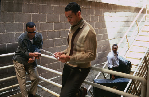 Ray Charles (JAMIE FOXX, left) replaces his early manager, Jeff Brown (CLIFTON POWELL, right), with Joe Adams (HARRY LENNIX, center) in the musical biographical drama, Ray.