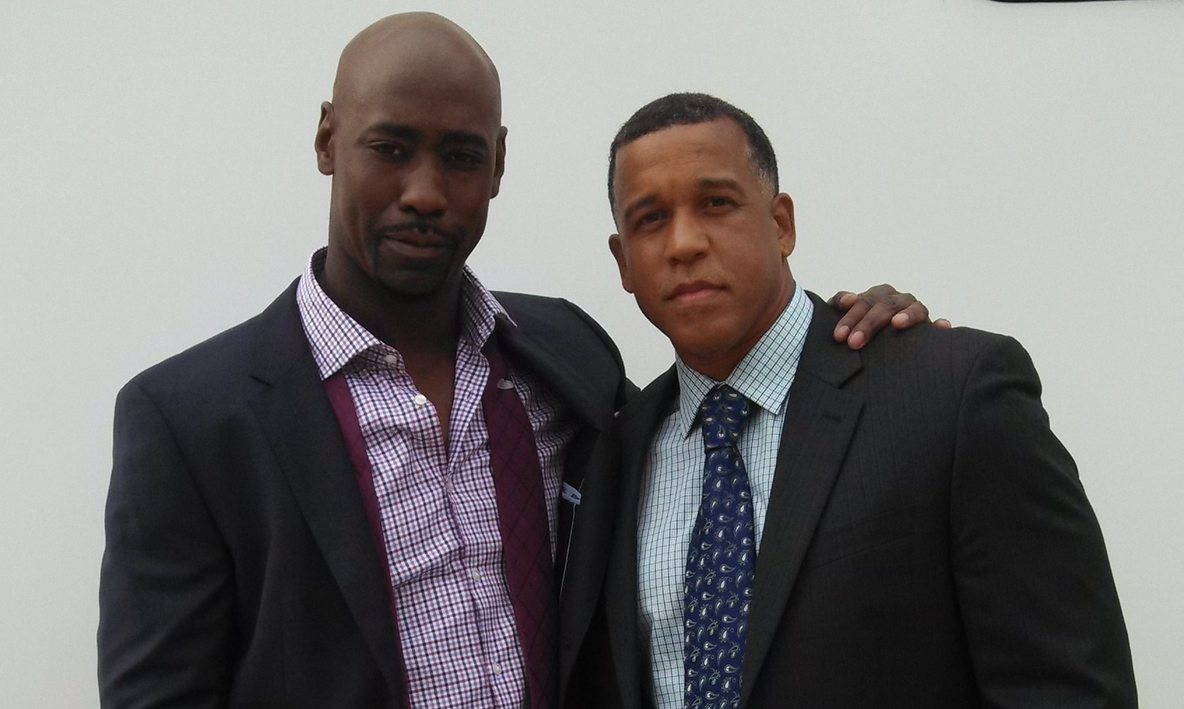 Griffin (Leon Pridgen) with Malcolm (D. B. Woodside) on the set of 