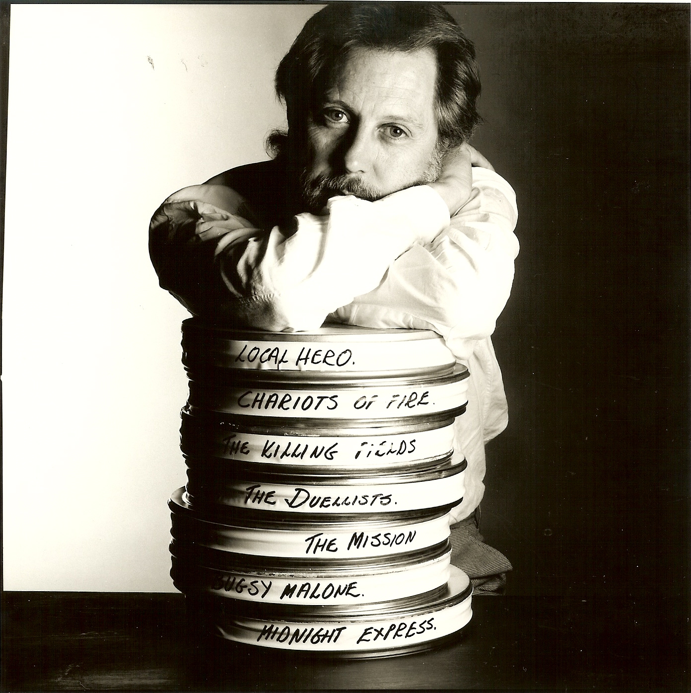 David Puttnam with film reels
