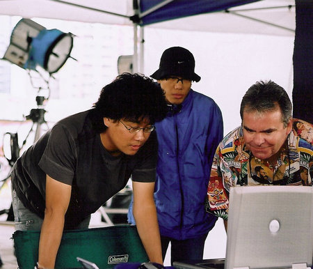 Director Bong Joon-Ho and Rafferty review CG shots on the set of The Host