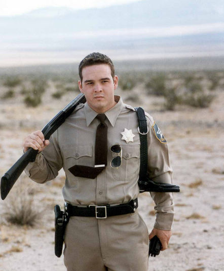 Jay C. Resar as Rookie Cop in 