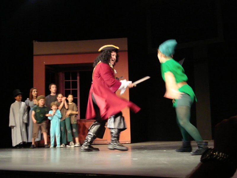 Roger Rignack as Captain Hook sword fighting Peter Pan.