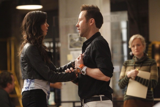 Still of Michael Rosenbaum and Odette Annable in Breaking In (2011)