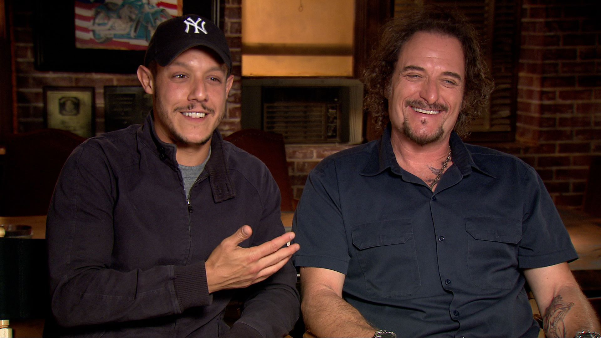 Still of Kim Coates and Theo Rossi in IMDb: What to Watch (2013)