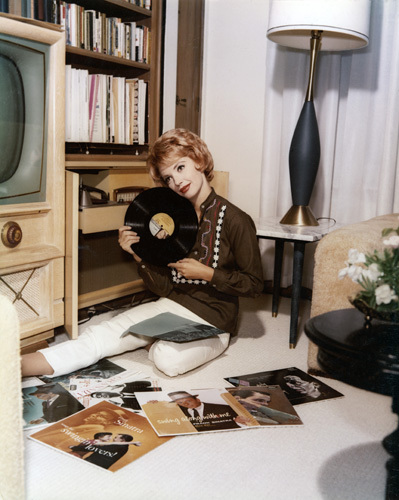 Barbara Rush at home listening to her Frank Sinatra record albums